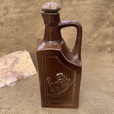 Antique brown stoneware spirit - brown,
