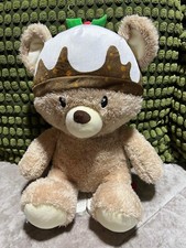 CLINTONS  CHRISTMAS TEDDY BEAR WEARING A  XMAS PUDDING HAT 13” 