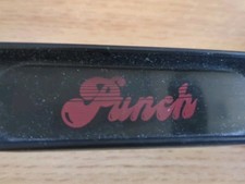 long handled black plastic shoe horn with Punch logo