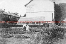 F006035 Portsmouth Two women are standing by the house F Slaughter Florist