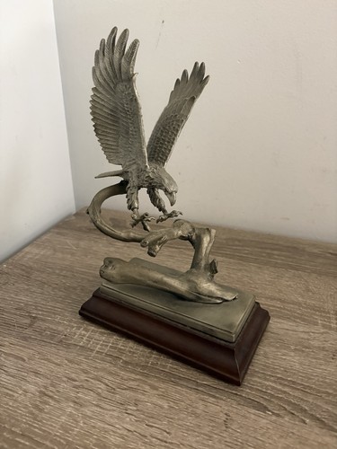 Pewter eagle sculpture landing