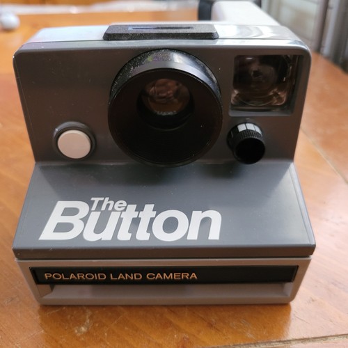 Polaroid the button land - the,