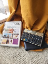Hewlett Packard 12C financial Calculator and Pouch and rare book collectors item
