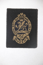 BRITISH ARMY QUEEN'S REGIMENT CLOTH BADGE WOVEN GOLD ON BLACK