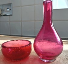 Cranberry glass probably Victorian bowl and vase.