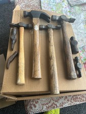 4 vintage hammers and 4