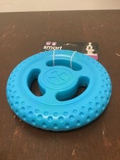 Rubber wheel dog toy with internal squeaker 