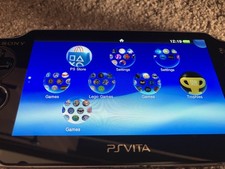 Sony PlayStation Vita Gaming System PCH-1003 With 64GB Memory Card
