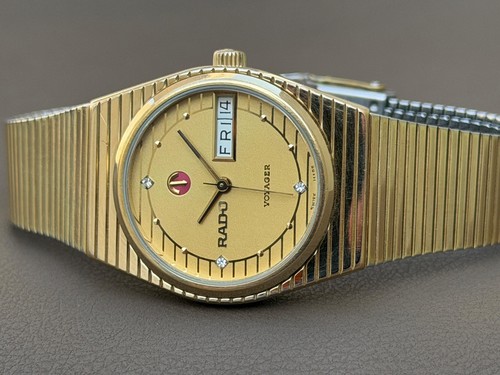 Rado voyager day - date, gold