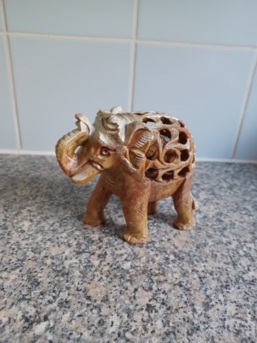 Hand carved elephant with - hand,