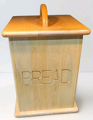 Tall wooden bread bin with - bread,