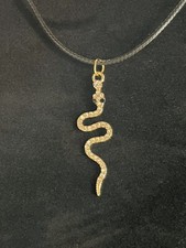 Snake Necklace In Gold Colour With Zirconia On A Black Cord