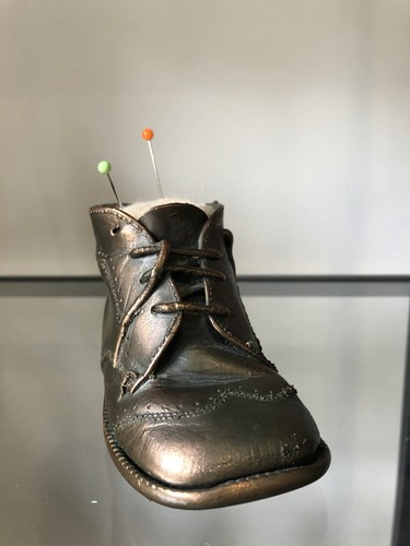 Bronzed baby shoe used a - as,