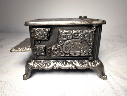 Antique cast iron daisy toy - cast,