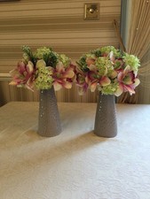 artificial flowers arrangement  in vase,  burgundy orchid with greenery 
