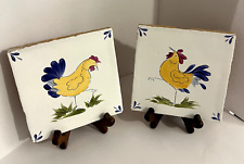 Two colourful hand painted chicken tiles with glazed finish. Stands included. 