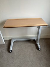 Adjustable Up And Over Table Disability Table.
