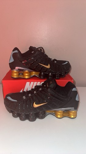 Black and gold nike - black,