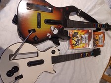 Wii Guitar Hero Bundle. 2 Guitars And 2 Games, World Tour And Legends Of Rock