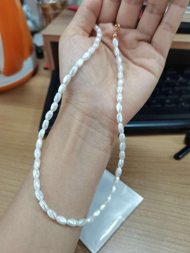 Pearl necklace cultured - pearl,