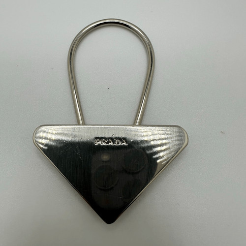 Prada triangle silver tone key - prada,