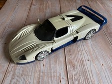 Maserati MC12, likely a Hot Wheels Elite or AUTOart modelwhite and blue livery.