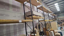 Job lot 42.9M run of heavy duty pallet racking shelving with wooden shelves.