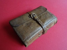 AN ANTIQUE HARDY LEATHER FLYFISHING WALLET + COLLECTION OF ARTIFICIAL  LURES