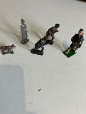 5 metal figurines , soldiers, bagpipe player , cow