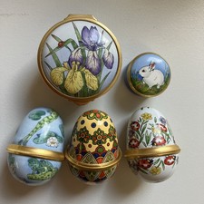 A collection of staffordshire enamel trinket pots. 