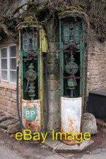 Old petrol pumps in winter