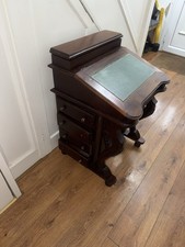 mahogany Davenport desk with a green leather writing surface.