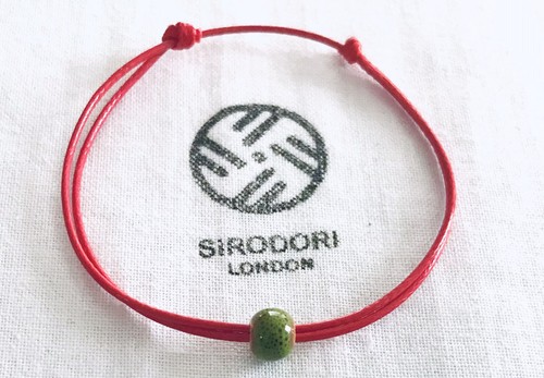 Kabbalah red string green - red,