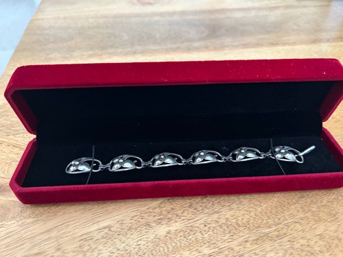 Silver george jones bracelet - a,