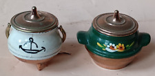 2 small metal pots one cauldron with anchor design the other barge ware design