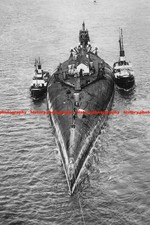 F027646 Tugboats tow cruiser von der Tann upside down to Rosyth Harbor Scapa Flo