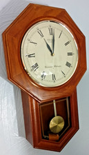 SEIKO OCTAGONAL FRONTED QUARTZ WALL CLOCK WITH PENDULUM & WESTMINSTER CHIMES.
