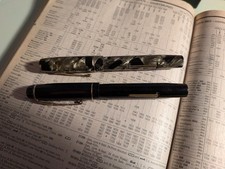 Two "Unique" pens, one with gold nib and one with steel nib