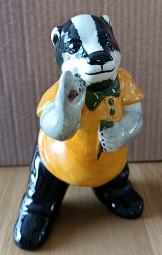 Dart playing badger figurine