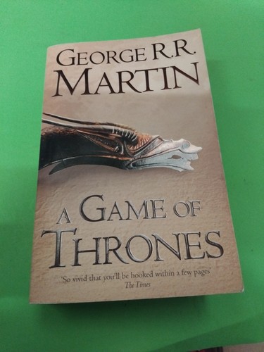 Paperback book game of - paperback,