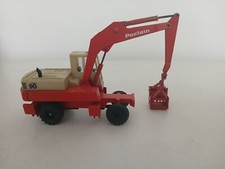 Conrad/Gescha Poclain 90 wheeled 360 excavator with clamshell grab.