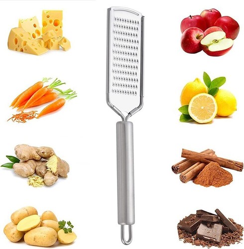 Hand held cheese grater - held,