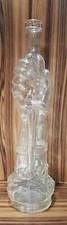 Antique Italian figural bottle with hand holding dagger. Clear. Made in Italy