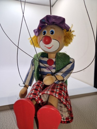 Wooden string hand held clown - wooden,