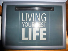 Cushioned tray for supporting laptop computer, food dish,  etc. in chair or bed.