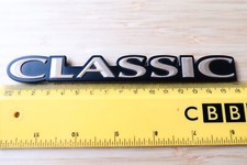 'CLASSIC' SUBARU LEGACY OUTBACK AWD BLACK & GOLD PLASTIC REAR BADGE 20.5cm.