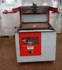 EDL COMMERCIAL HEAT SHRINK PACKAGING MACHINE IN GWO AND SPARE ROLLS OF SHRINK.