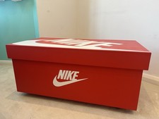 Large red Nike branded wooden