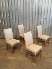 A set of 4 modern limed oak dining chairs