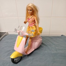 Barbie moped scooter and barbie.